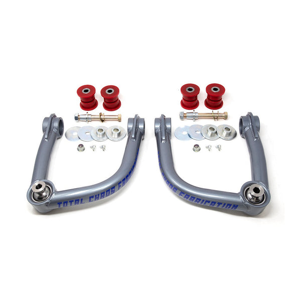 Pair of gray Total Chaos upper control arms with red polyurethane bushings and mounting hardware for 2021 Bronco.