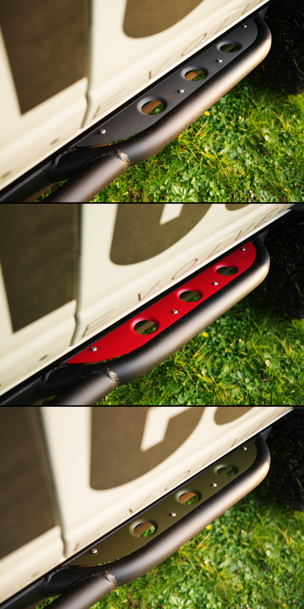 Close-up of 2021 Bronco 4-door Sidewinder rock sliders with black, red, and olive metal step plates installed on white vehicle.