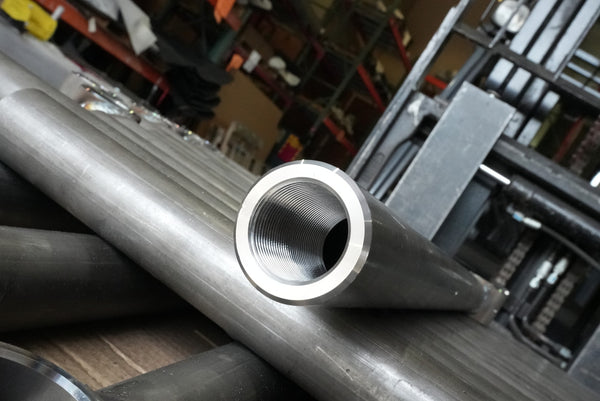 Close-up of a threaded metal tube end for 3rd Gen 4Runner rear lower link, showing smooth machining and steel finish.