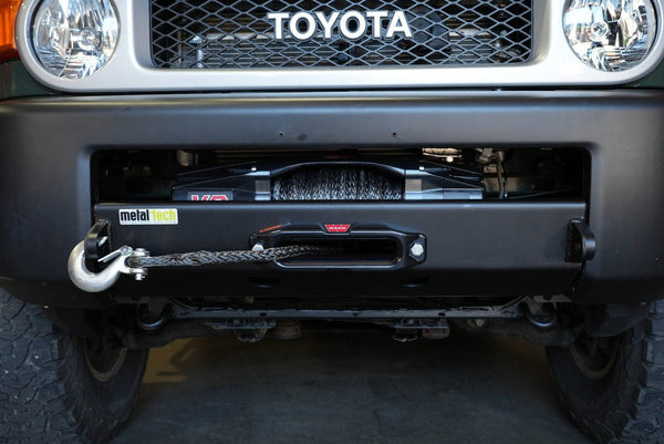 Front view of Toyota FJ Cruiser with Metal Tech Stronghold winch bumper and synthetic winch rope installed.