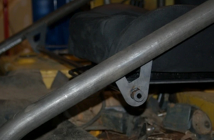 Close-up of Metal Tech FJ40 Land Cruiser seat cradle system showing metal frame attachment point and seat base.