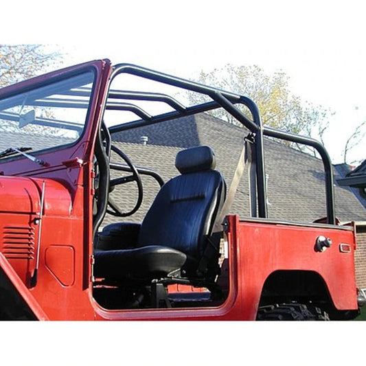 Red FJ40 Land Cruiser with black Jackson roll cage kit installed, showing driver's seat and open door.