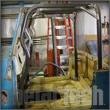 Close-up of metal roll cage front frame tie kit installed inside a vintage Toyota FJ40 Land Cruiser chassis.
