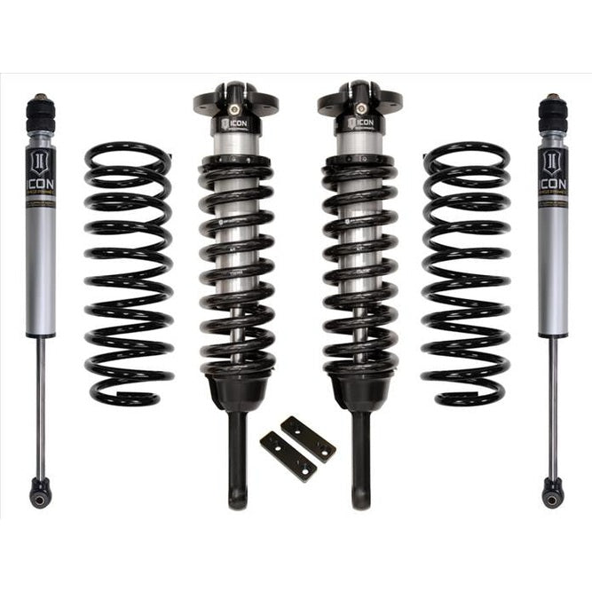 Stage 1 suspension system for 2003-2009 Lexus GX470 with coil springs, shocks, and struts laid out on white background.