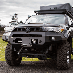 Front view of 5th Gen Toyota 4Runner with Metal Tech Fortress steel bumper and winch installed outdoors.