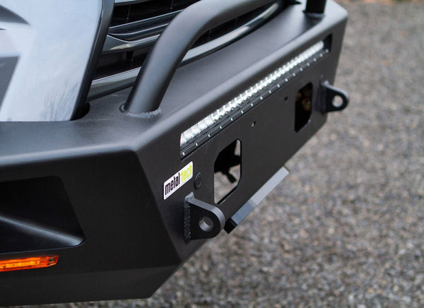 Close-up of black Metal Tech Tiger Shark front bumper with integrated LED light bar and tow hooks on Lexus GX460.