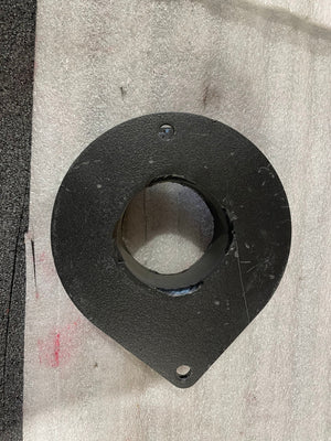Top-down view of a black metal front spacer plate with two mounting holes, showing minor surface scratches.