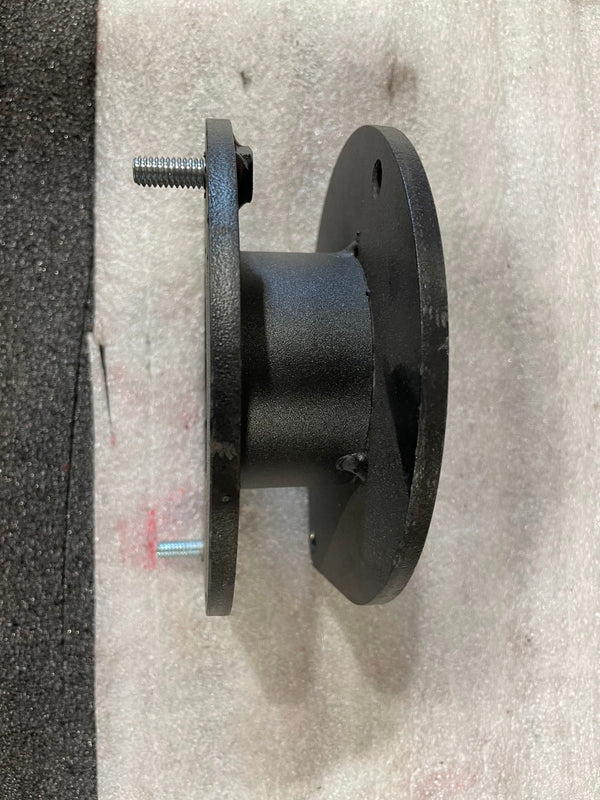 Side view of black metal front spacer plate with two bolt studs, showing slight surface wear.