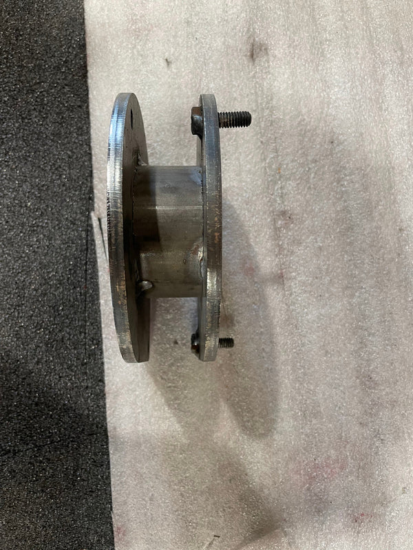 Side view of a scratch-and-dent metal spacer plate for FZJ80 front suspension, no hardware included.