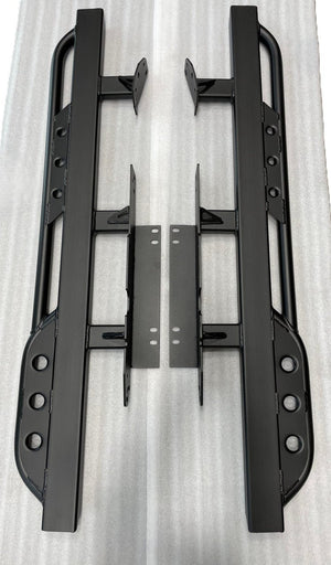 Pair of black metal rock sliders with mounting brackets for 2008-2021 Toyota Land Cruiser, laid flat on white surface.