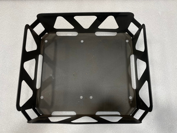 Top view of a black metal utility basket with geometric cutouts and handles on two sides.