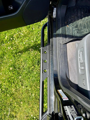 Close-up of black Metal Tech rock slider installed on 2008-2021 Toyota Land Cruiser door sill.