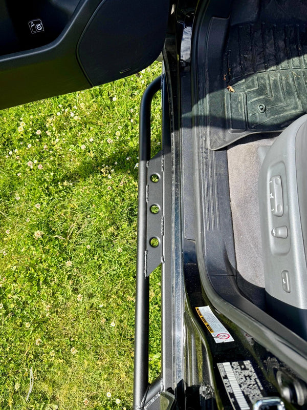 Close-up of black Metal Tech rock slider installed on 2008-2021 Toyota Land Cruiser door sill.