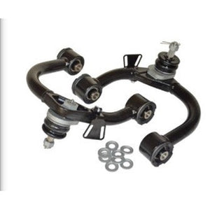 Pair of black upper control arms with bushings and mounting hardware for Land Cruiser LX470 suspension upgrade.