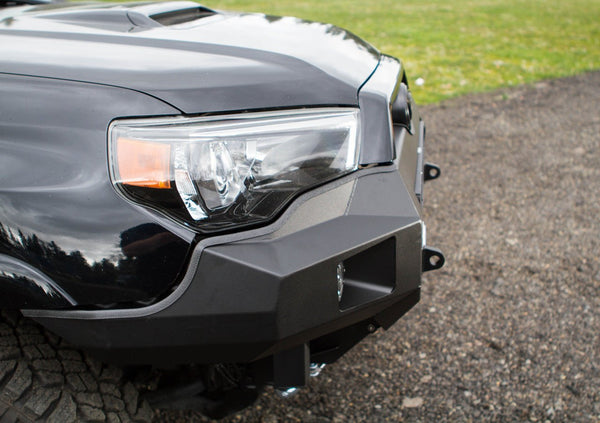 Close-up of black Metal Tech Fortress front bumper installed on 5th Gen 4Runner with headlight and turn signal visible.