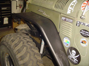 Close-up of black Metal Tech tube fender installed on front wheel of olive green Toyota FJ40 Land Cruiser.