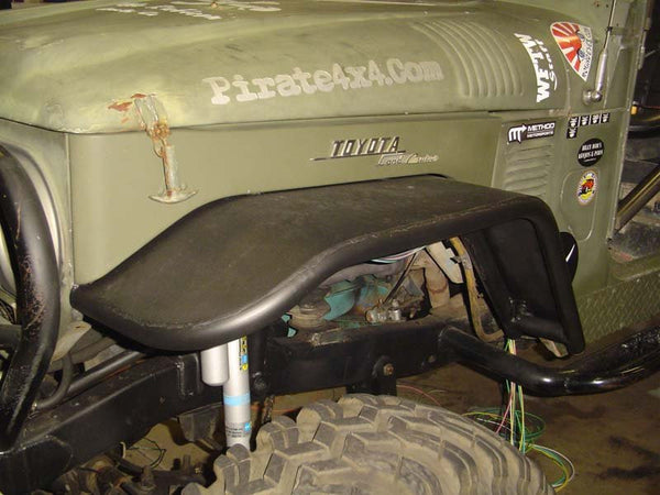 Close-up of black Metal Tech tube fender installed on front driver side of olive green Toyota FJ40 Land Cruiser.