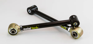 Two black adjustable rear suspension links with gold and black bushings for 80 Series Land Cruiser LX450.