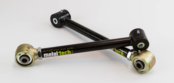Two black adjustable rear suspension links with gold and black bushings for 80 Series Land Cruiser LX450.