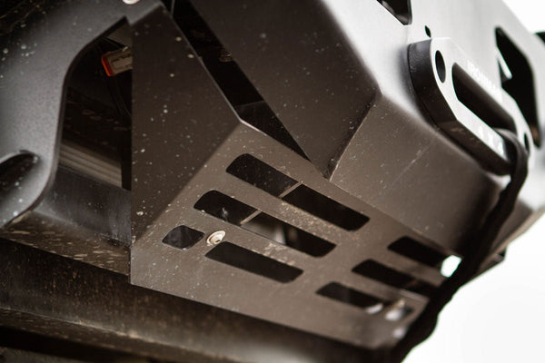 Close-up of metal skid plate on Metal Tech FJ Cruiser Phantom front bumper with black textured finish and mounting bolts.