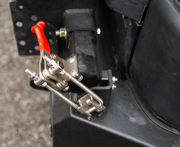 Close-up of red latch mechanism on Metal Tech FJ Cruiser Red Eye II rear swing-out bumper.