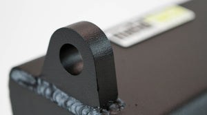 Close-up of black powder-coated metal mounting bracket with welds on FJ Cruiser winch bumper.