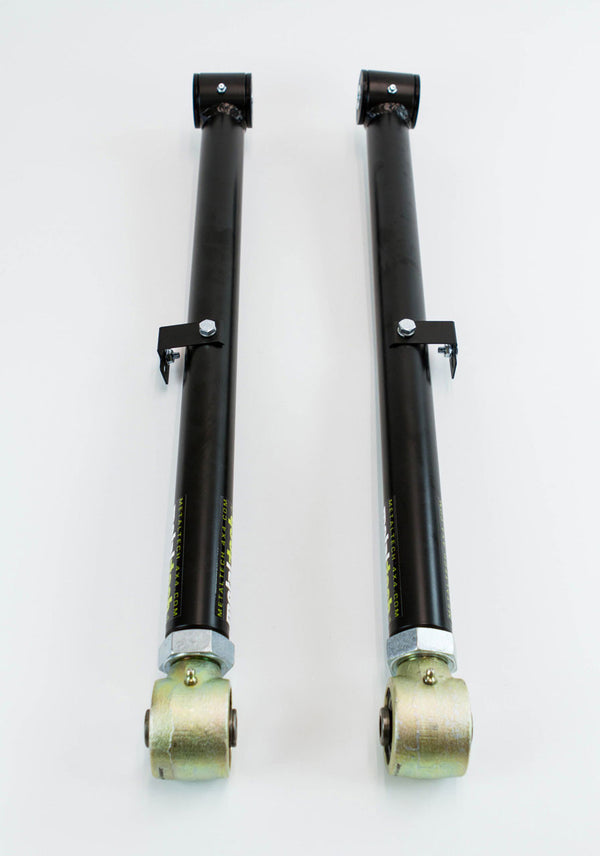 Pair of black metal offset rear lower suspension links with gold-colored rod ends for FJ Cruiser and 4Runner vehicles.