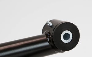 Close-up of black metal rear suspension link with grease fitting for FJ Cruiser and 4Runner.