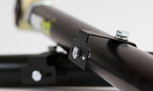 Close-up of black metal rear link with mounting bracket and bolts for FJ Cruiser and 4Runner suspension upgrade.