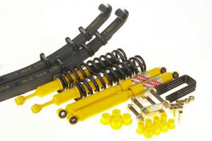 Complete suspension kit with yellow shocks, black coil springs, leaf springs, and hardware for 2005-2015 Tacoma light load lift.
