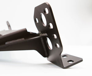 Close-up of black metal bracket with multiple mounting holes for 2014 4Runner Stronghold winch bumper installation.