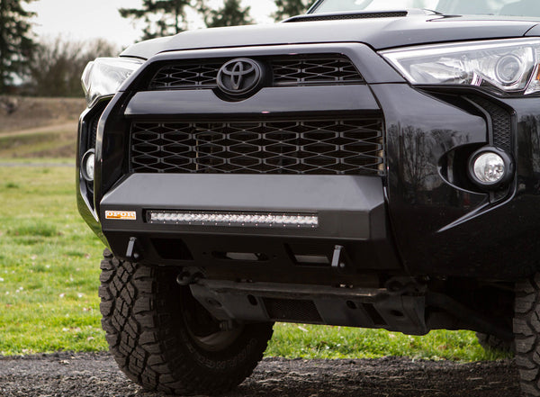 Front view of black 2014 Toyota 4Runner with MetalTech 4x4 Stronghold winch bumper and LED light bar installed.