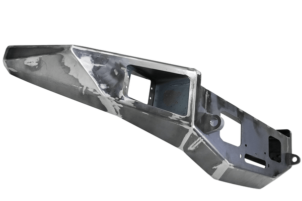Raw steel Metal Tech Phantom front bumper for FJ Cruiser with cutouts for lights and winch mount.