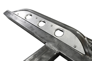 Close-up of raw steel 2021 Bronco 4-door Sidewinder rock slider with three circular cutouts on white background.