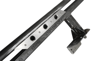 Close-up of metal sidewinder rock slider bracket with welded mounting plate for 2021 Bronco 4-door.