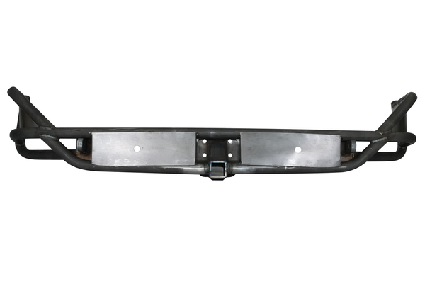 Raw metal rear tube bumper for FJ Cruiser with hitch receiver and reinforced side bars, front view.