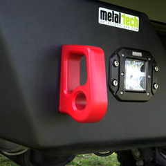 Close-up of red aluminum rear bumper pull point with Cerakote finish installed on black metal bumper.