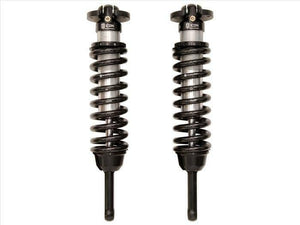 Pair of black front coilover shock absorbers with springs for 2007-2009 FJ Cruiser, GX470, and 4Runner vehicles.