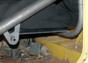 Close-up of Metal Tech FJ40 Land Cruiser seat cradle system installed on vehicle floor frame.