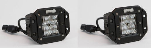 Pair of black 20W flange mount LED flood fog lights with clear lenses and wiring connectors.