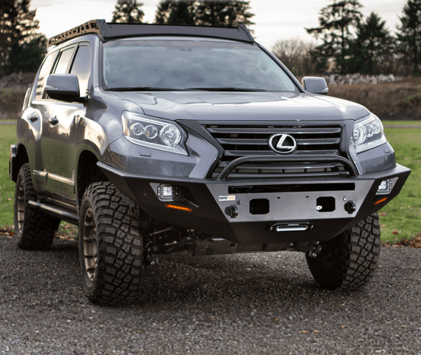 Front view of 2014-2023 Lexus GX460 with Metal Tech Tiger Shark steel front bumper installed on gravel.
