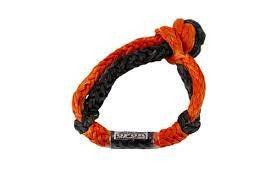 Close-up of orange and black Opor soft shackle with metal clasp, rated for 38,500 lbs load capacity.