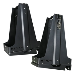 Pair of black metal double fuel can carriers with mounting holes and latch, designed for off-road 4x4 vehicles.