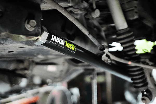 Close-up of Metal Tech offset rear lower link installed on 2001-2007 Sequoia suspension system.