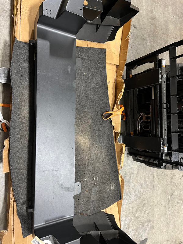 Matte black metal rear bumper for 2010 Lexus GX460, shown uninstalled on cardboard and foam padding.