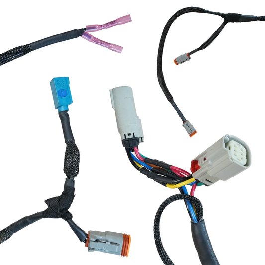 Close-up of Bronco 6G Aces High rear bumper plug-and-play wiring harness with multiple connectors and protective sleeving.